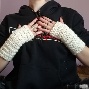 white crocheted fingerless gloves